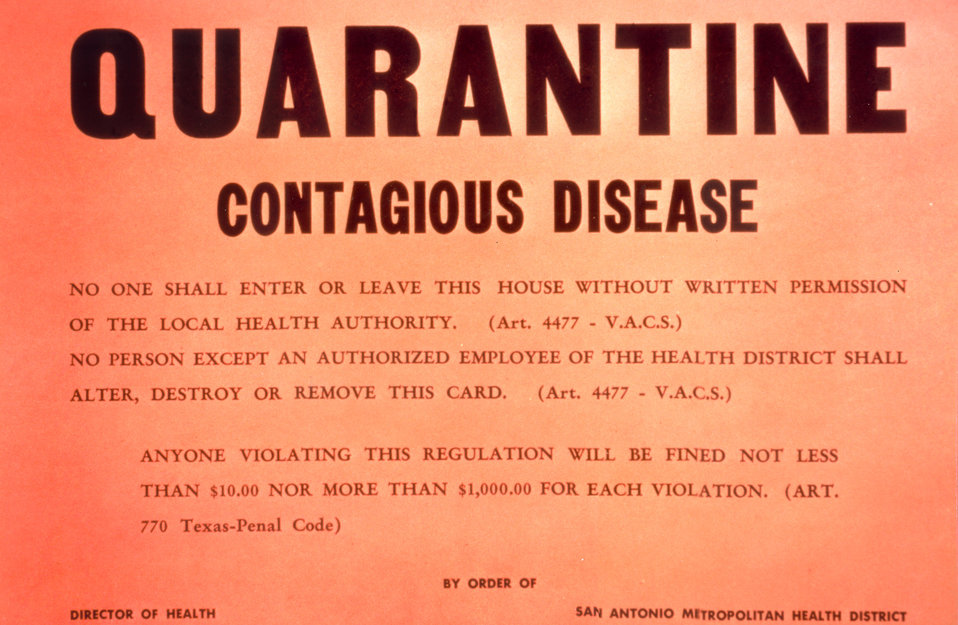 A typed quarantine warning on a bright red background
