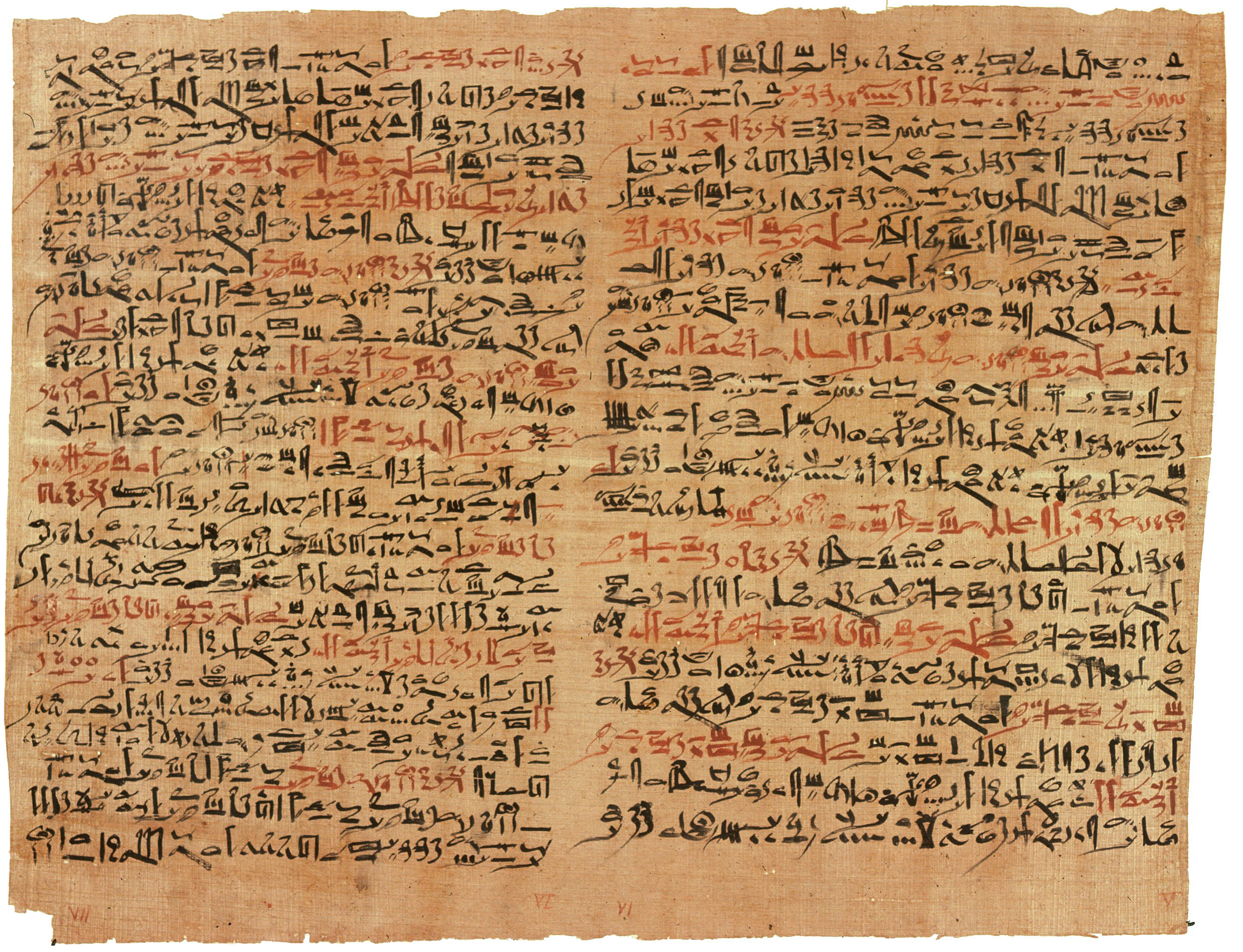 Image of papyrus paper that is old, brown, and worn. The text is written in two columns in black and red ink.