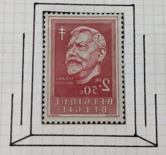 A red stamp with a black line on a graph paper

Description automatically generated